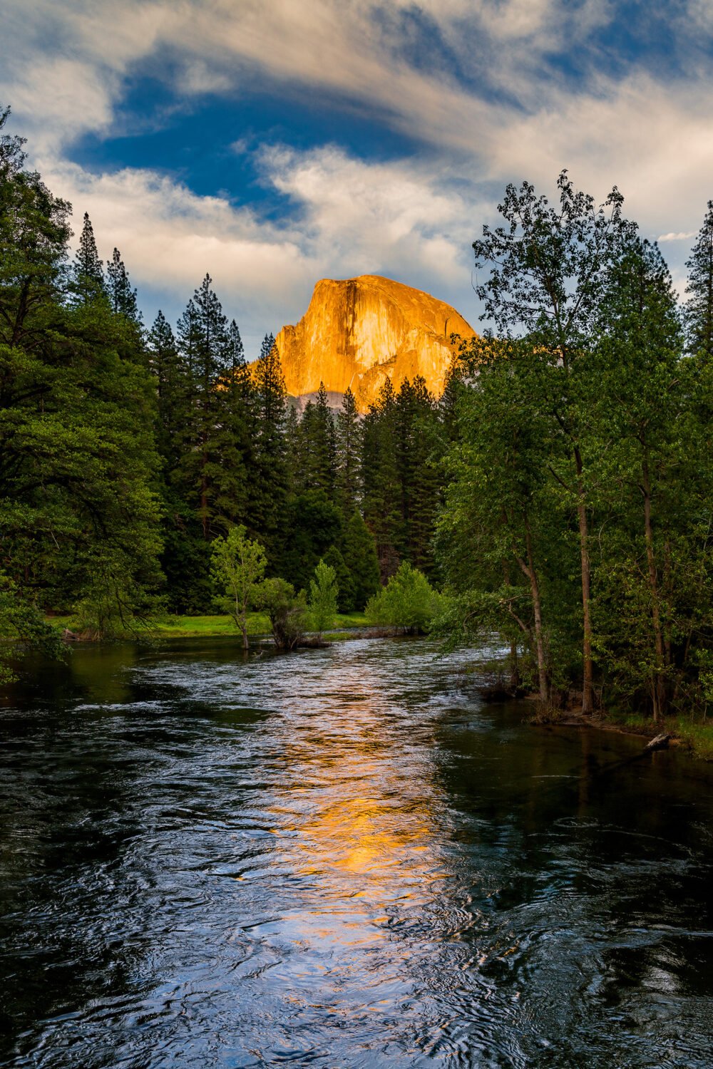 Sunset and often sunrise is special in Yosemite National Park as in this image of Half Dome's illumination reflecting in the Merced River
