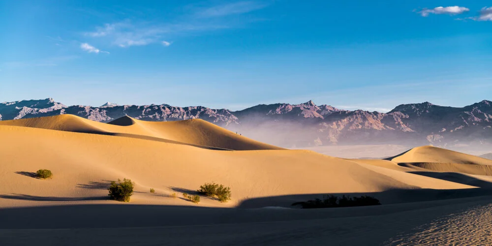 Sunrise lights up the sand dunes of Death Valley