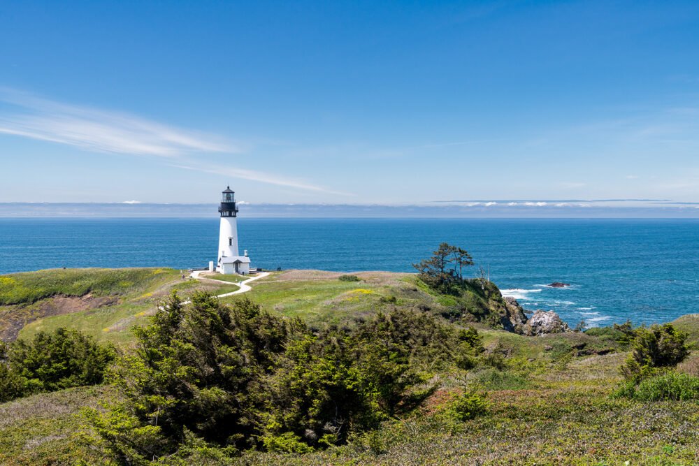 The Yaquina Head Lighthouse stands majestically over the Oregon Coast as seen from the Yaquina Head Outstanding Natural Area