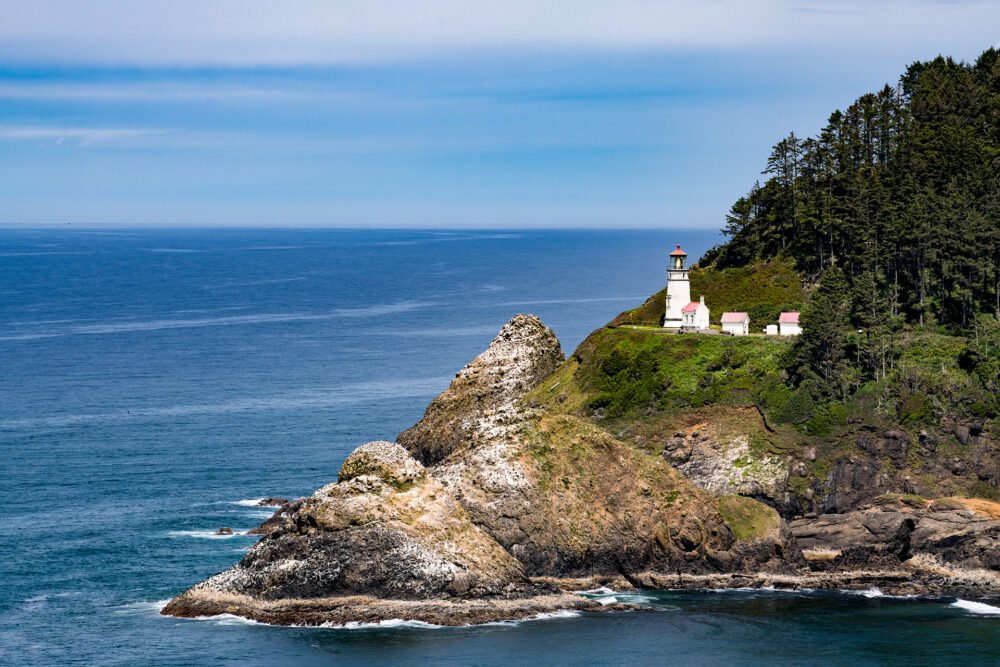 Sitting on a sea cliff, the Heceta Head Lighthouse overlooks the rugged Oregon Coast