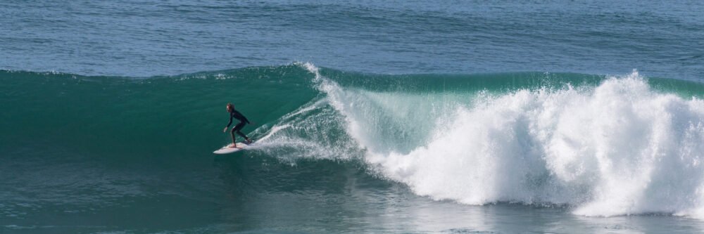 Big waves after a storm at Swami's Beach in Southern California invite surfing photography and are fun to watch - panorama