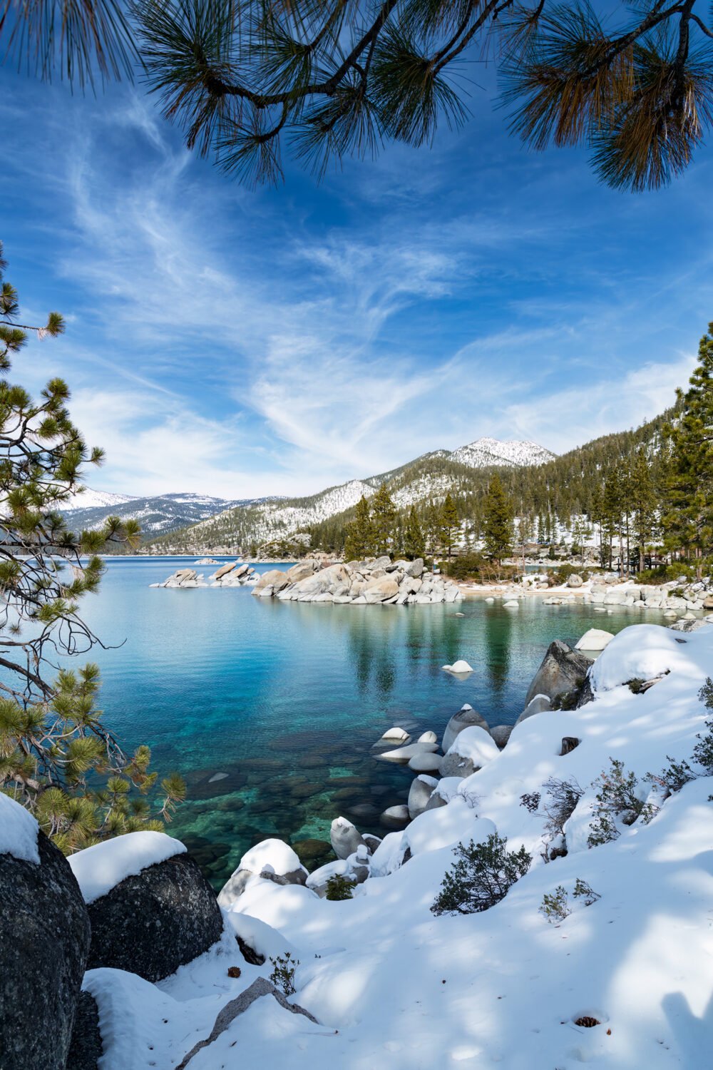 Lake Tahoe is an incredibly beautiful lake surrounded by snow covered mountains