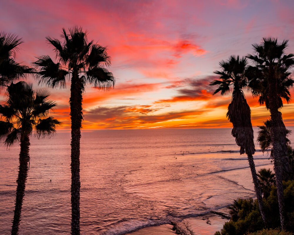 Surfing and watching a beautiful sunset at Swami's Beach along the California coast