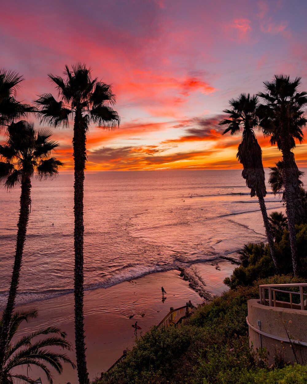 Watching surfing and a brilliant and colorful sunset at Swami's Beach along the California coast at Swami's Beach