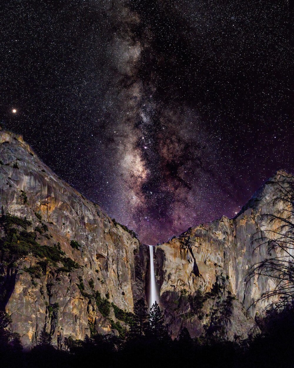 Viewing the Milky Way lighting up the sky as moon illuminates Bridalveil Fall from the Merced River in Yosemite Valley