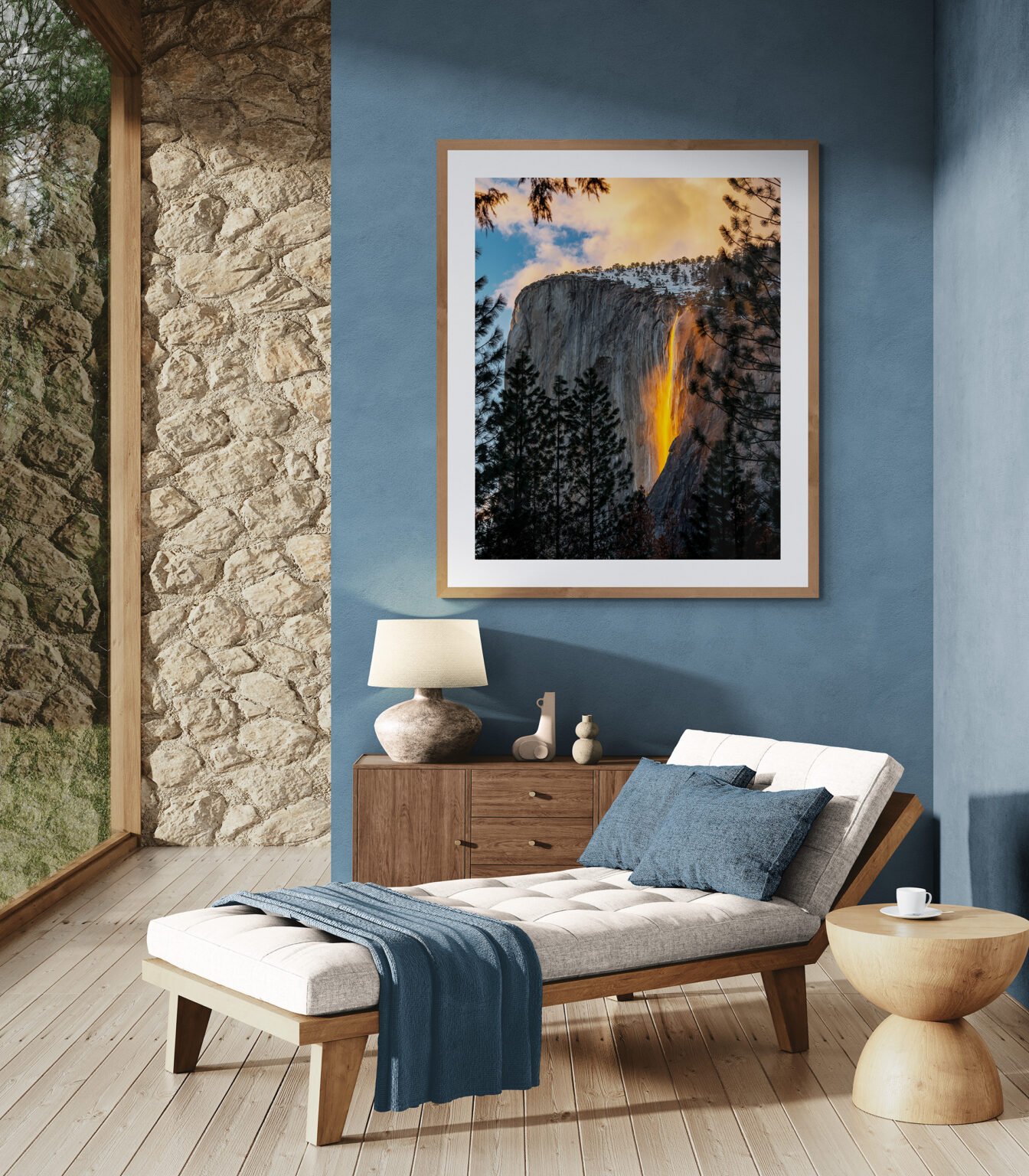 Yosemite National Park's Horsetail Fall is lit up by sunset creating the dramatic Firefall display in a living room with a comfy lounger.