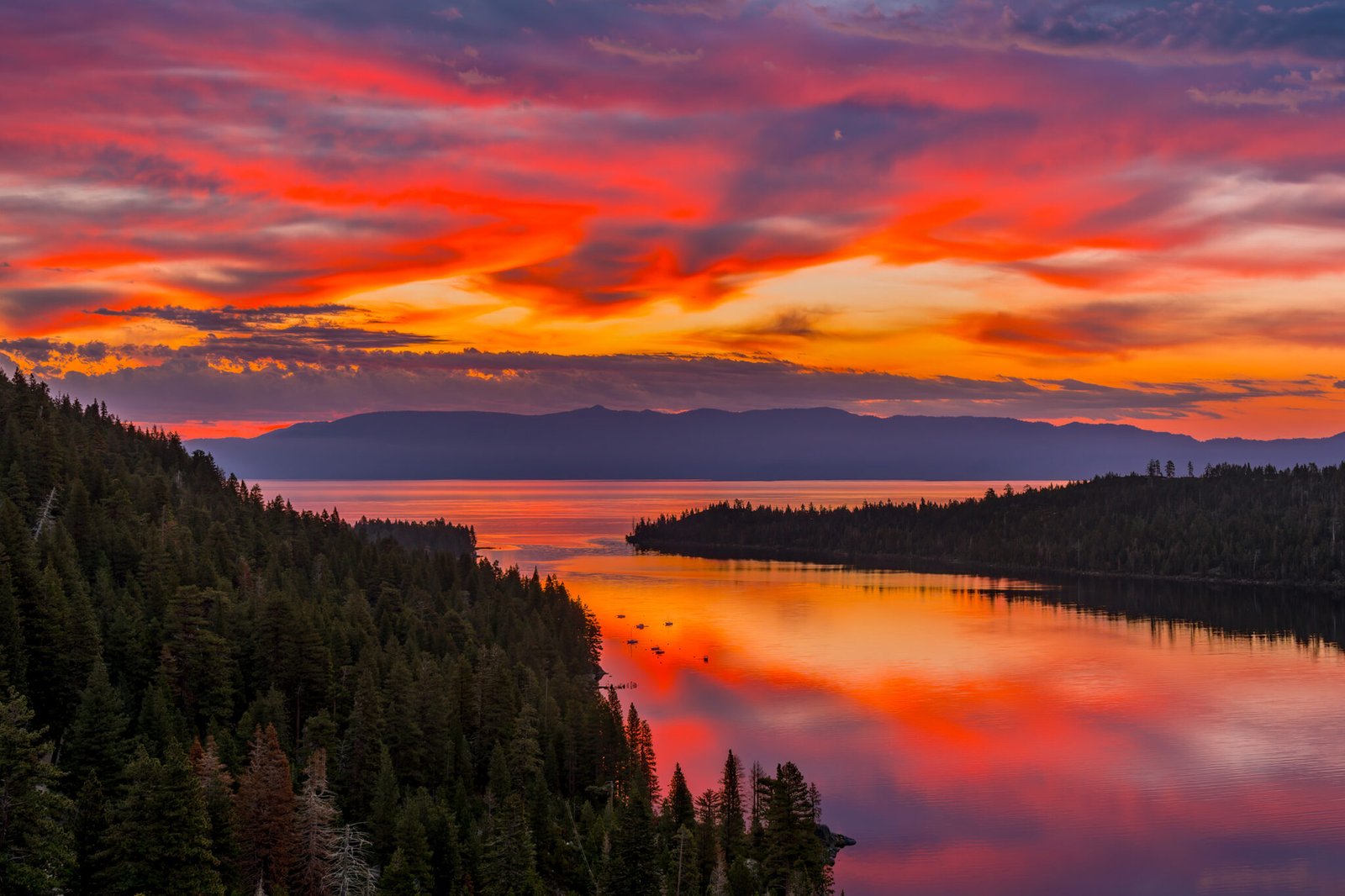 Lake Tahoe is beautiful all day, but can be absolutely stunning as in this picture showing sunrise reflecting in the lake and framed by mountains